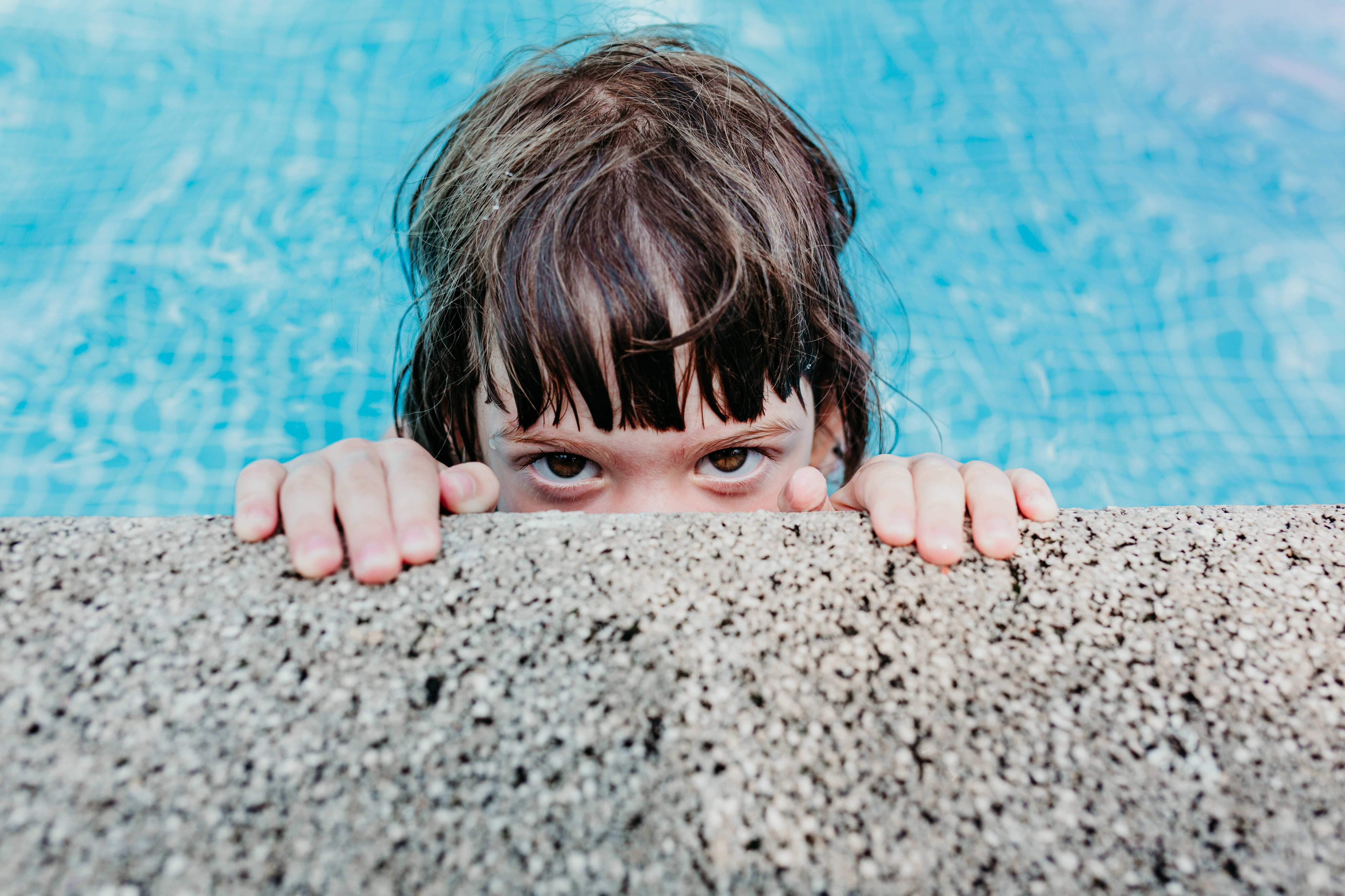 portrait of a beautiful kid girl in a pool. Smiling. Fun and sum portrait of a beautiful kid girl in a pool. Smiling. Fun and summer lifestyle